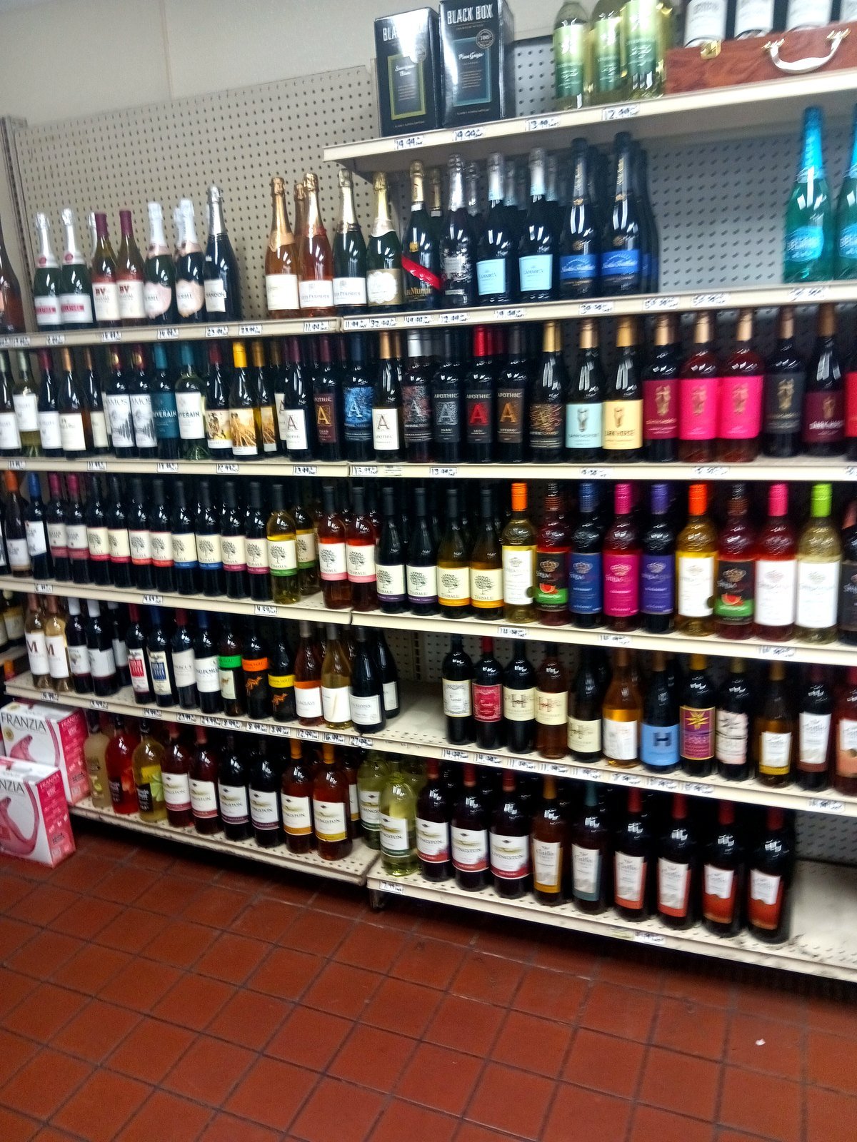 The wine wall at E.B. Jr Market — rows of reds, whites, rosé and sparkling